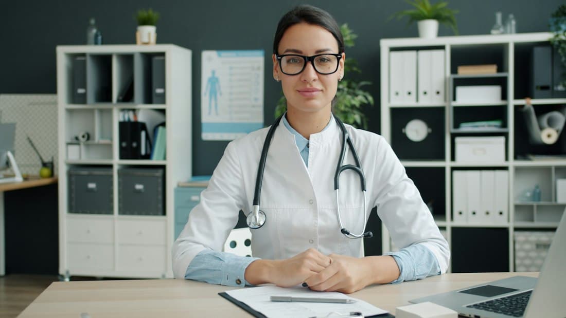Physician at her desk in a clinic office