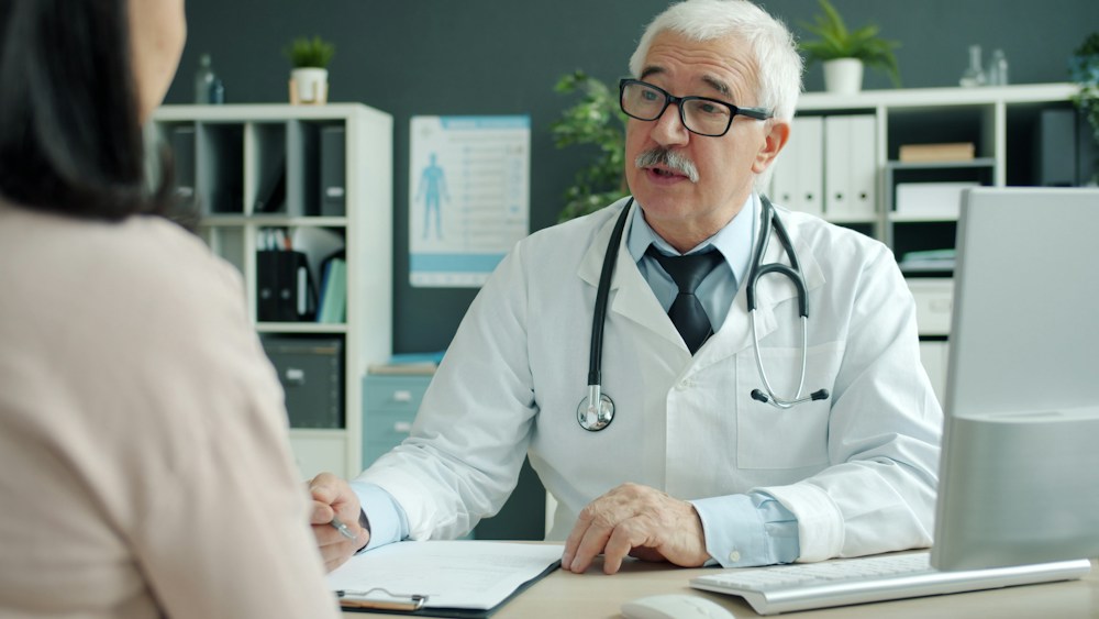 A doctor talking with a patient