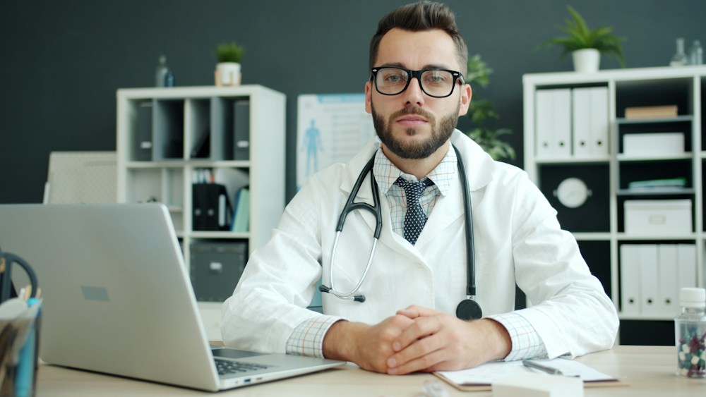 A doctor at his desk